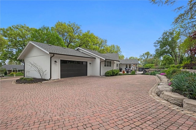 9818 Overbrook Ct, Leawood, KS 66206 - view of property exterior with decorative driveway and a garage