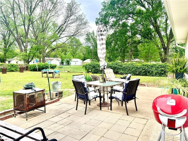view of patio / terrace featuring fence and outdoor dining area
