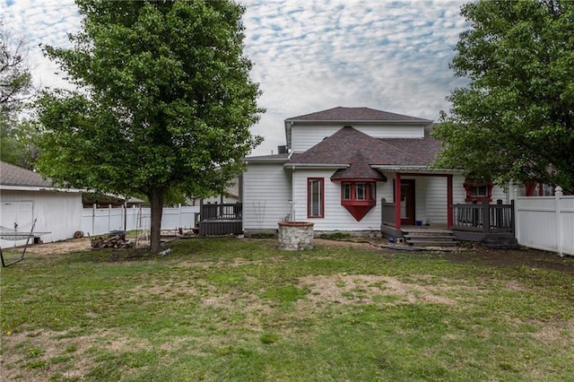 516 Parker St, Osawatomie, KS 66064 - rear view of property with a deck