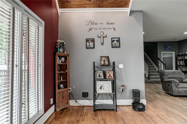 516 Parker St, Osawatomie, KS 66064 - hall featuring plenty of natural light, wood finished floors, stairs, and baseboards