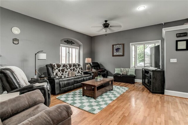 516 Parker St, Osawatomie, KS 66064 - living room with ceiling fan, light wood finished floors, and baseboards