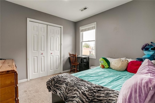 516 Parker St, Osawatomie, KS 66064 - carpeted bedroom featuring a closet and baseboards