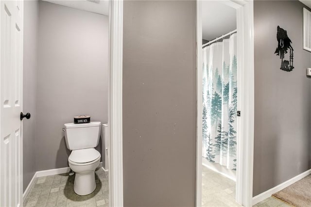 516 Parker St, Osawatomie, KS 66064 - bathroom with toilet and baseboards