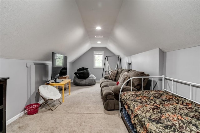 516 Parker St, Osawatomie, KS 66064 - carpeted bedroom with lofted ceiling, baseboards, a textured ceiling, and recessed lighting