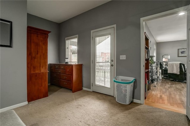 516 Parker St, Osawatomie, KS 66064 - doorway to outside with carpet floors and baseboards