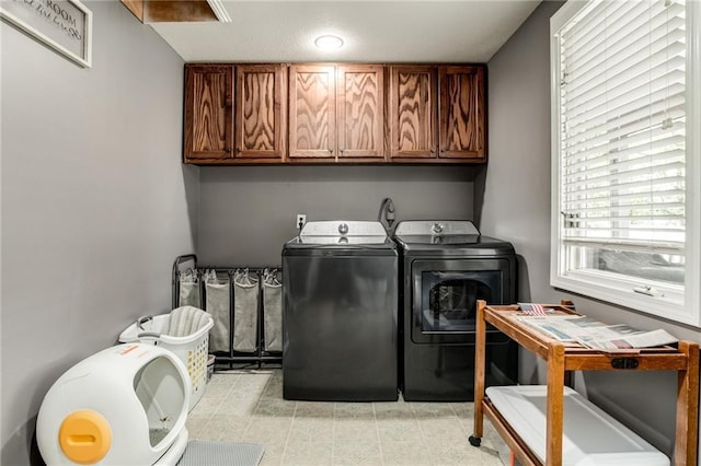516 Parker St, Osawatomie, KS 66064 - laundry room featuring cabinet space and washer and clothes dryer