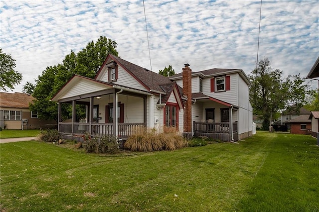 516 Parker St, Osawatomie, KS 66064 - view of front of home featuring a front lawn and covered porch