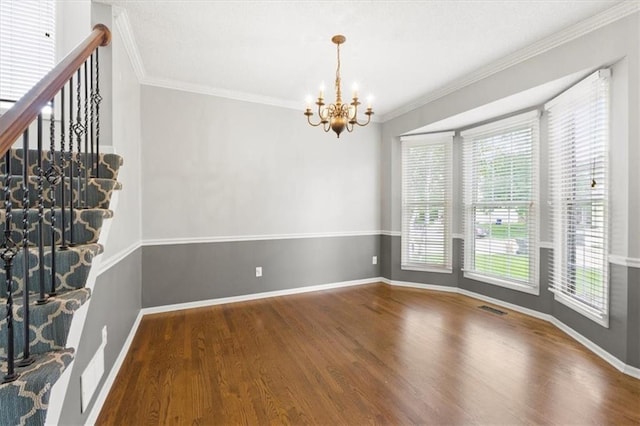 14175 W 149th Ter, Olathe, KS 66062 - unfurnished room featuring a chandelier, wood finished floors, crown molding, and baseboards