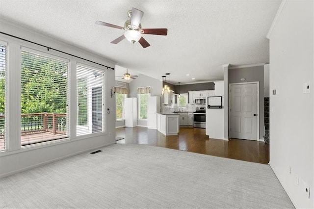 14175 W 149th Ter, Olathe, KS 66062 - unfurnished living room featuring dark carpet, ceiling fan, baseboards, ornamental molding, and a textured ceiling