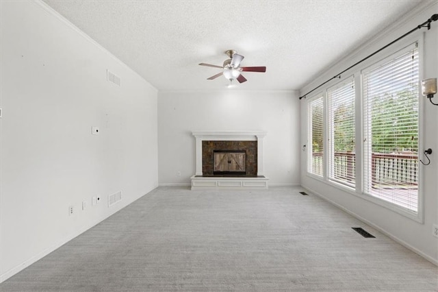 14175 W 149th Ter, Olathe, KS 66062 - unfurnished living room with ceiling fan, a textured ceiling, a fireplace, and carpet