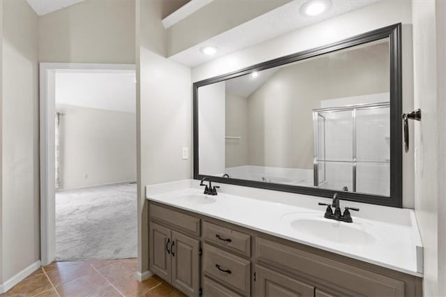 14175 W 149th Ter, Olathe, KS 66062 - bathroom featuring double vanity, an enclosed shower, tile patterned flooring, and a bathtub