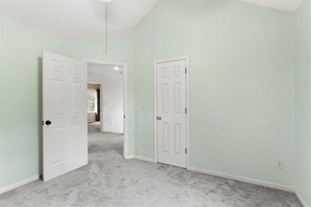 14175 W 149th Ter, Olathe, KS 66062 - unfurnished bedroom featuring carpet flooring, lofted ceiling, and baseboards