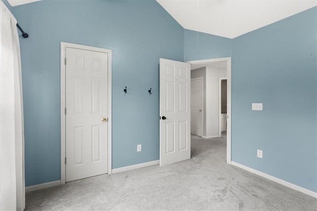 14175 W 149th Ter, Olathe, KS 66062 - unfurnished bedroom with carpet floors, vaulted ceiling, and baseboards