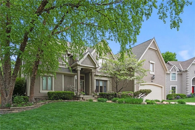 view of front facade featuring a front lawn and stucco siding