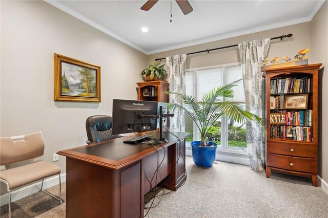 office with crown molding, a ceiling fan, baseboards, and light carpet
