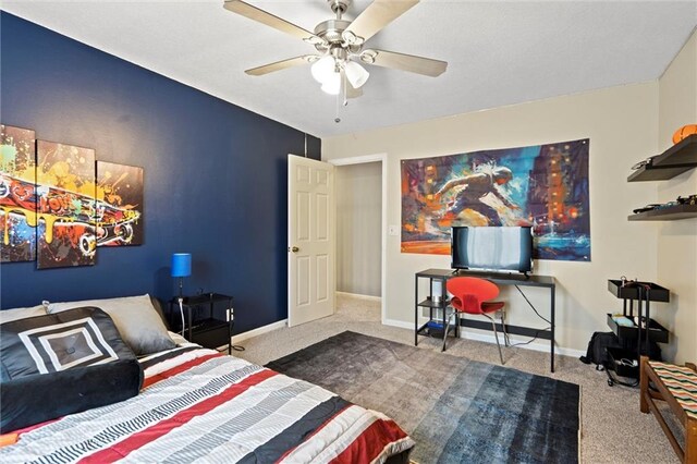 bedroom with carpet flooring, baseboards, and ceiling fan