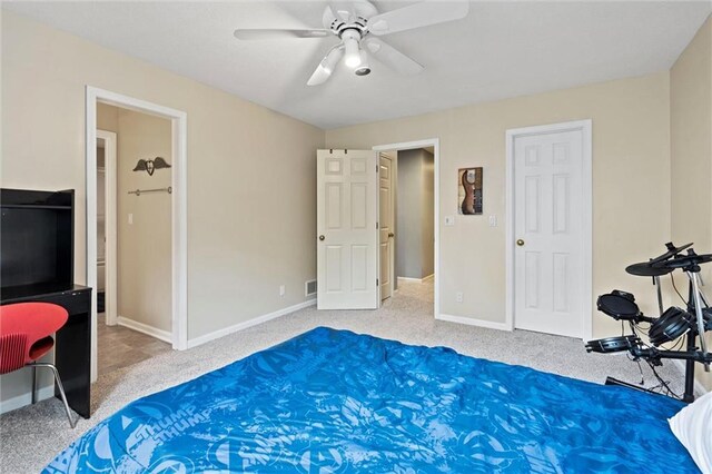 bedroom featuring baseboards, carpet flooring, and ceiling fan