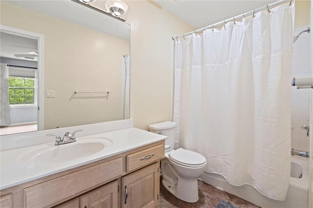 full bathroom with tile patterned floors, vanity, toilet, and shower / bath combination with curtain