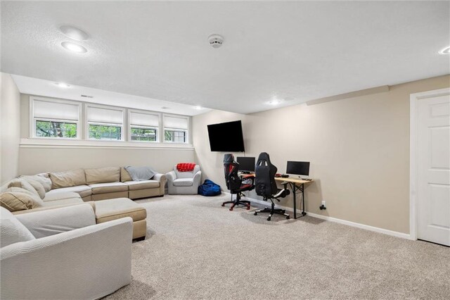 carpeted living room featuring baseboards and recessed lighting