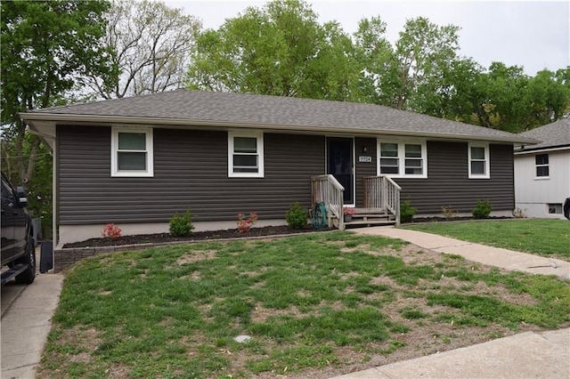 ranch-style home with a front lawn