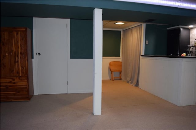 finished below grade area featuring carpet flooring