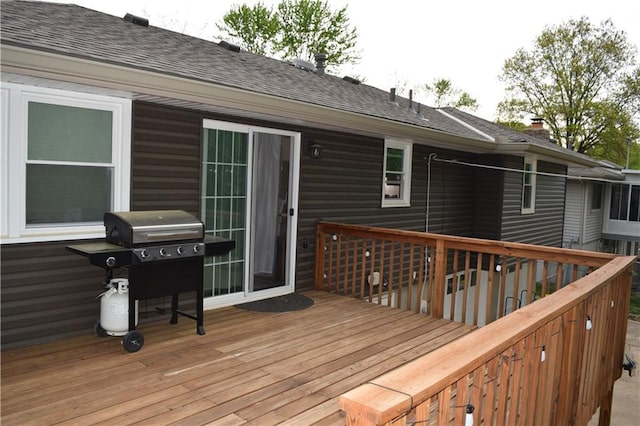 wooden deck featuring area for grilling