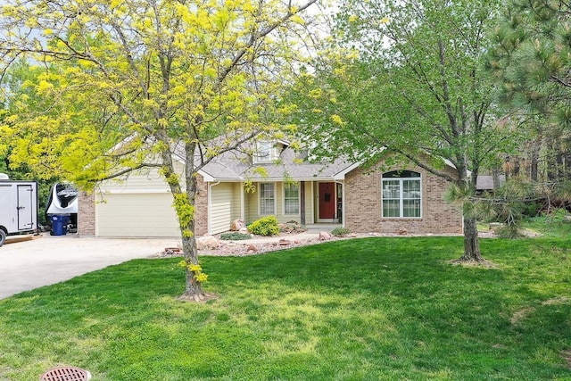 ranch-style home featuring a garage, driveway, a front lawn, and brick siding