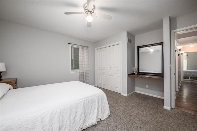 carpeted bedroom with baseboards, ceiling fan, a closet, and visible vents