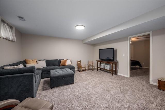 carpeted living room featuring baseboards and visible vents