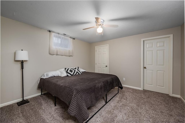 carpeted bedroom featuring baseboards and a ceiling fan