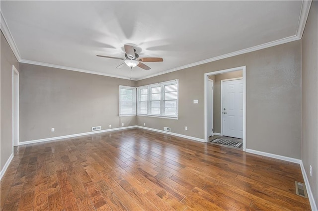 306 S 5th St, Neodesha, KS 66757 - spare room featuring baseboards, ornamental molding, a ceiling fan, and wood finished floors