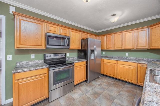 306 S 5th St, Neodesha, KS 66757 - kitchen with stainless steel appliances, ornamental molding, and light stone counters