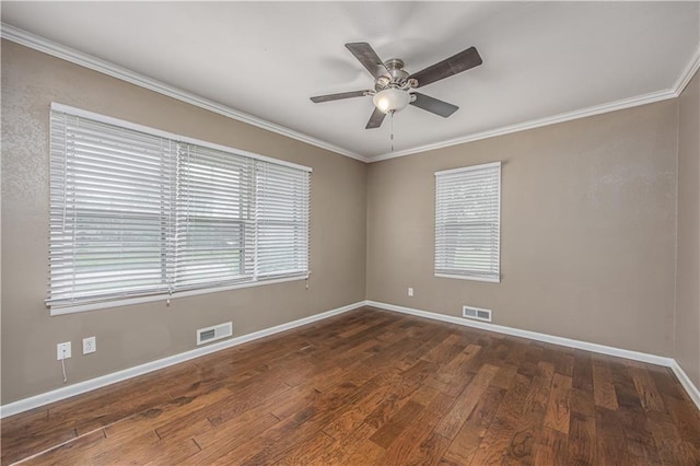 306 S 5th St, Neodesha, KS 66757 - unfurnished room with visible vents, a ceiling fan, ornamental molding, and dark wood finished floors