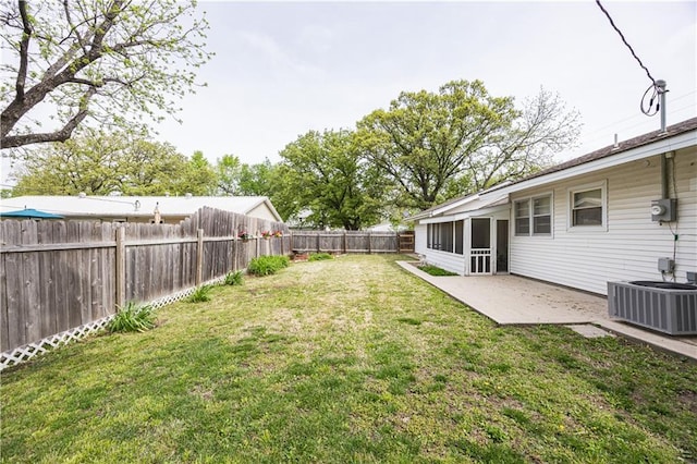 306 S 5th St, Neodesha, KS 66757 - view of yard with a patio area, a fenced backyard, and central air condition unit