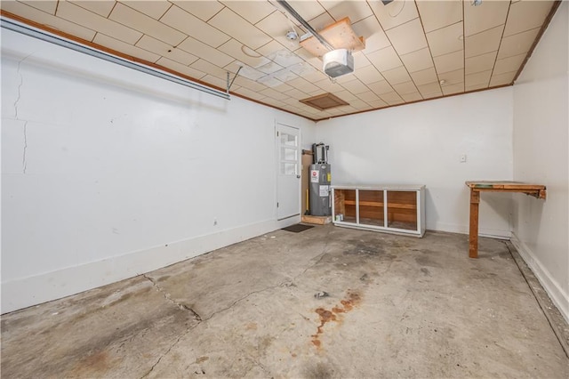 306 S 5th St, Neodesha, KS 66757 - interior space featuring electric water heater and a garage