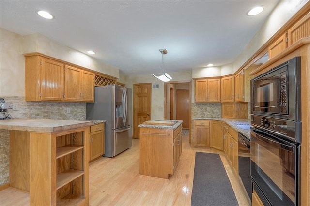 12341 Beverly St, Leawood, KS 66209 - kitchen with black appliances, a kitchen island, light countertops, decorative backsplash, and light wood-type flooring