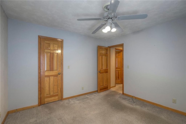 12341 Beverly St, Leawood, KS 66209 - unfurnished bedroom with baseboards, light colored carpet, and a ceiling fan