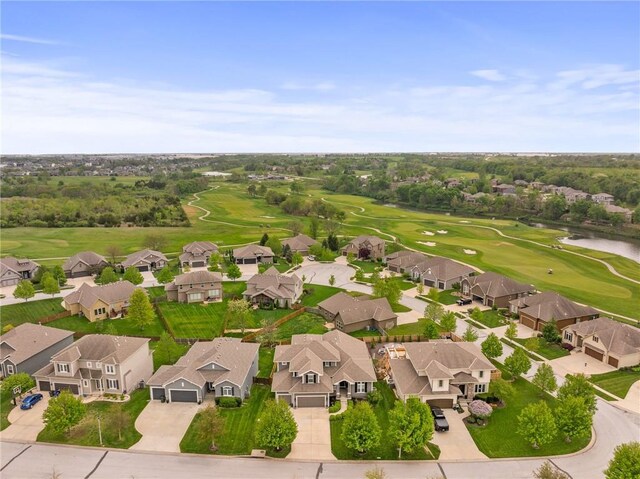 bird's eye view featuring a water view, golf course view, and a residential view