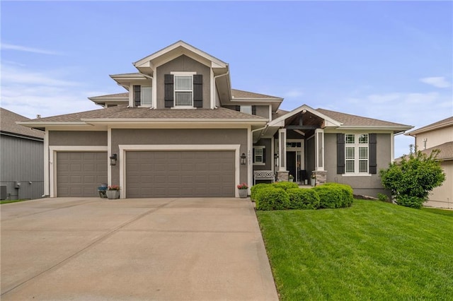 view of front of house with a garage, a front lawn, stucco siding, and concrete driveway