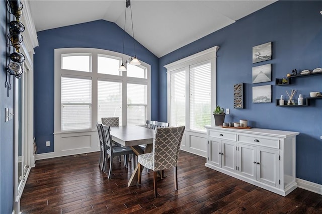 dining area with dark wood-style flooring and vaulted ceiling