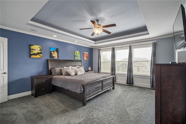 bedroom with a raised ceiling, ornamental molding, carpet, and baseboards