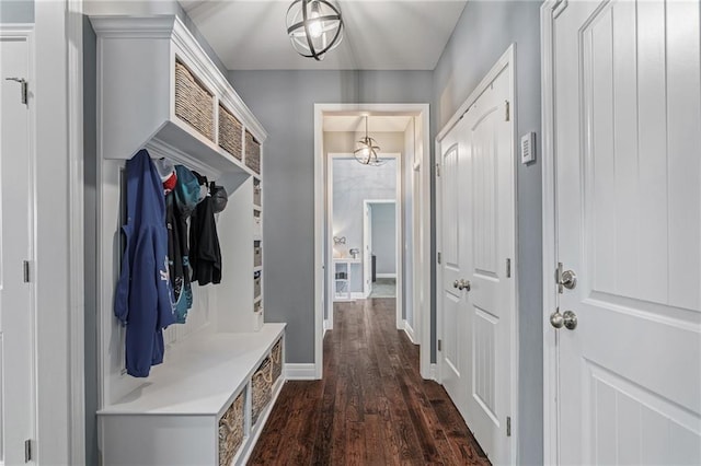 mudroom with baseboards and dark wood finished floors