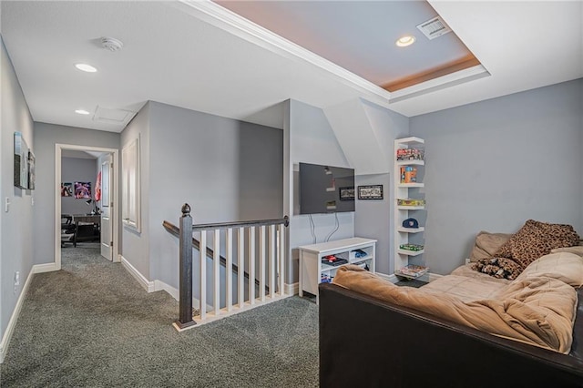 carpeted living area featuring baseboards, attic access, recessed lighting, and visible vents