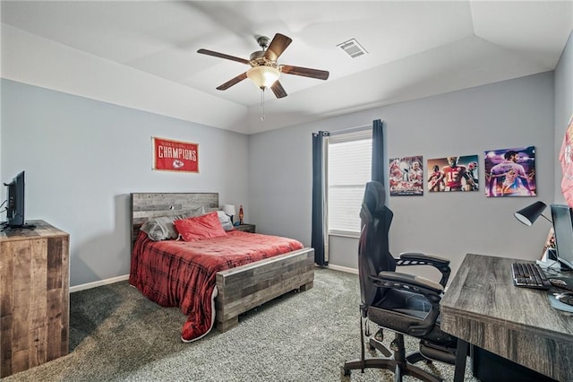 carpeted bedroom with visible vents, a ceiling fan, and baseboards