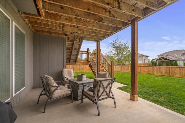 view of patio with a fenced backyard and stairway
