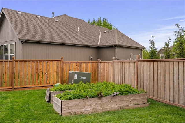 view of yard with fence private yard and a garden