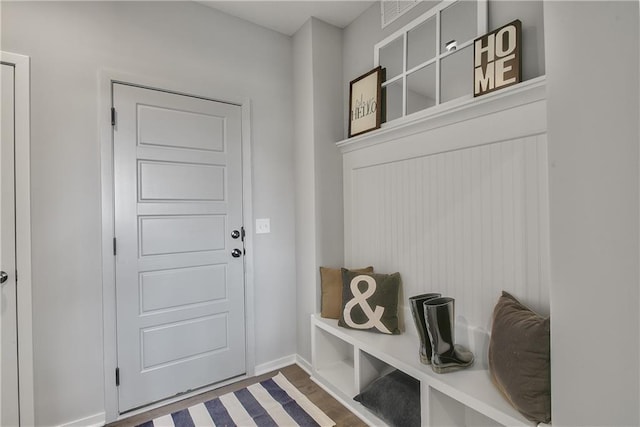 mudroom with baseboards and wood finished floors
