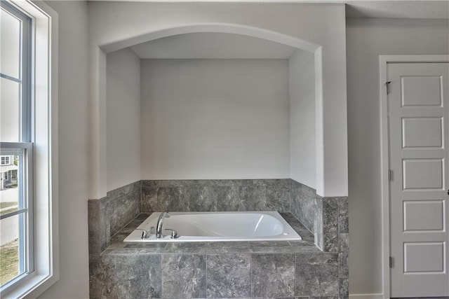 bathroom featuring a bath