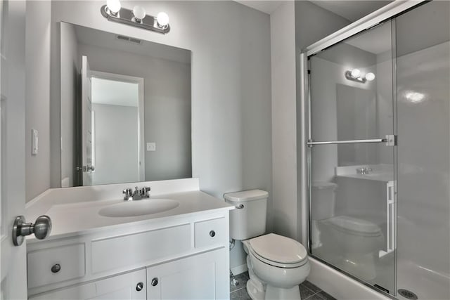 bathroom featuring a shower stall, tile patterned floors, vanity, toilet, and visible vents