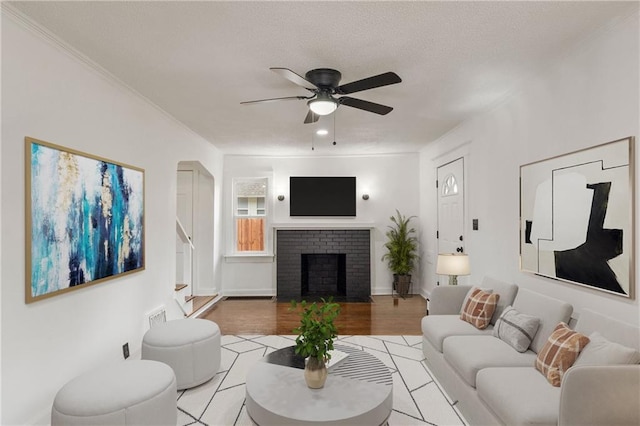 1133 E 75th St, Kansas City, MO 64131 - living area with a ceiling fan, a fireplace, and light wood finished floors